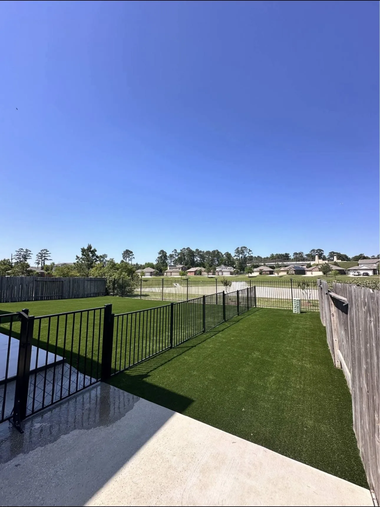Artificial turf with decorative stone border in Maryland