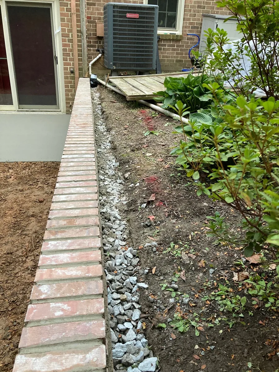 French drain installation in a Maryland backyard